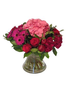 Een boeket bloemen in een vaas met Hortensia en pioenen en enkele grote gerbera's.